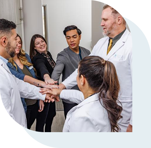 Staff of a dentistry holding morning huddle