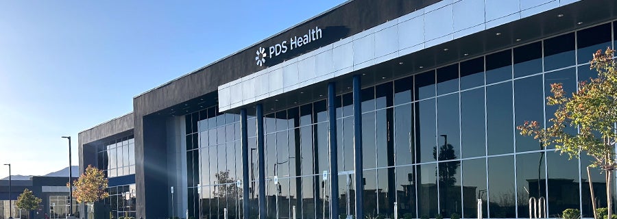 PDS Health employee reviewing latest company news online